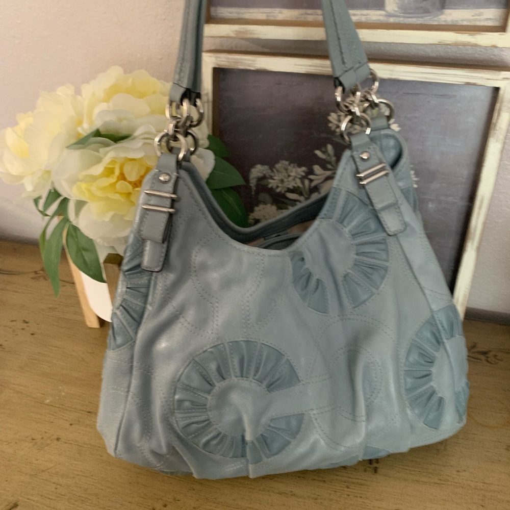 Blue Coach bag with silver detail. Like new.